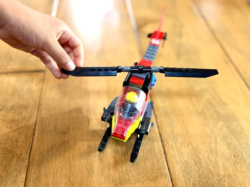 Jax playing with LEGO Fire Rescue Helicopter