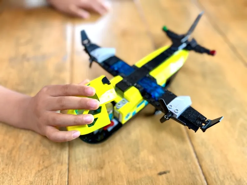 Jax playing with the medical aircraft from LEGO Remix 60505