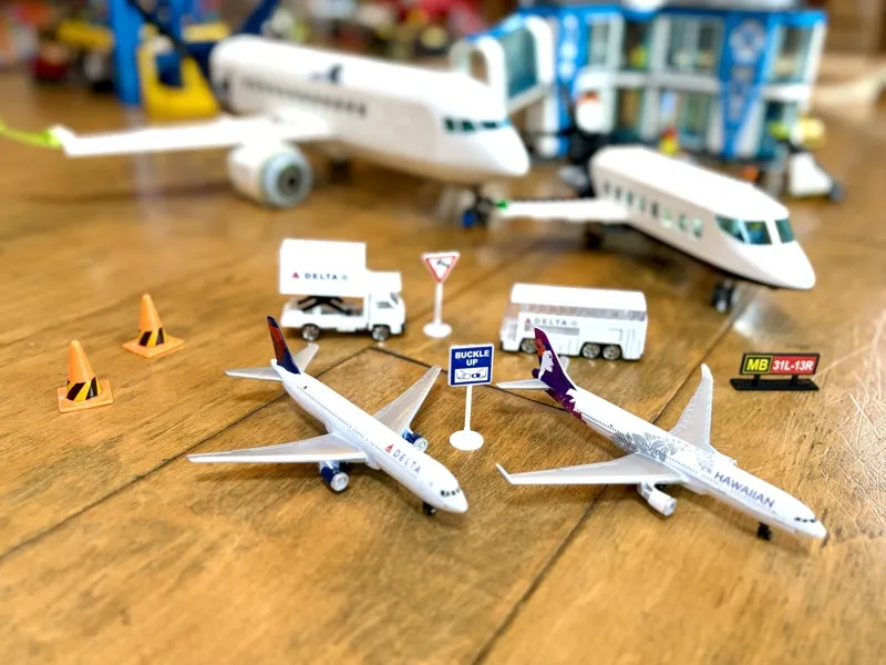 Jax's Daron model airplane collection with Delta and Hawaiian Airlines